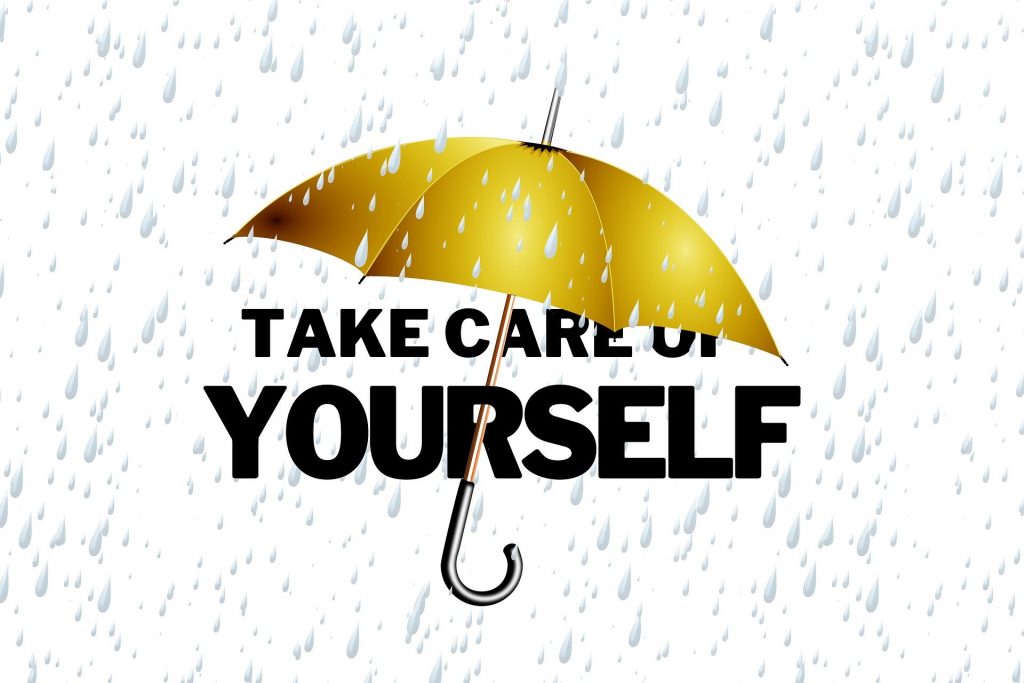 Ein Regenschirm, unter dem die Worte "Take Care of Yourself" stehen.